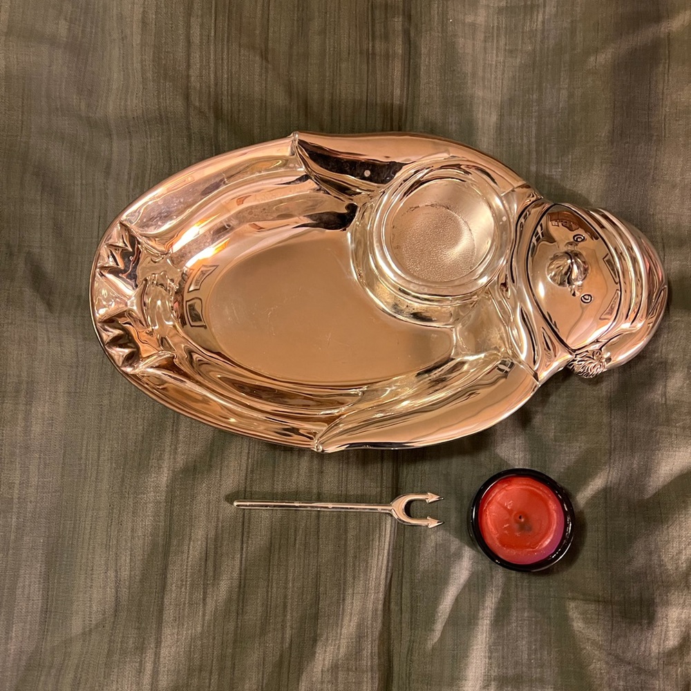 Vintage silver plate dip tray with candle in a penguin motif.